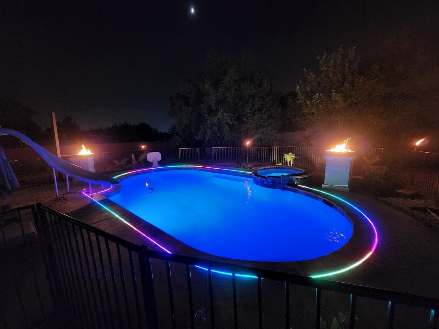 Pool with fire features and color lighting