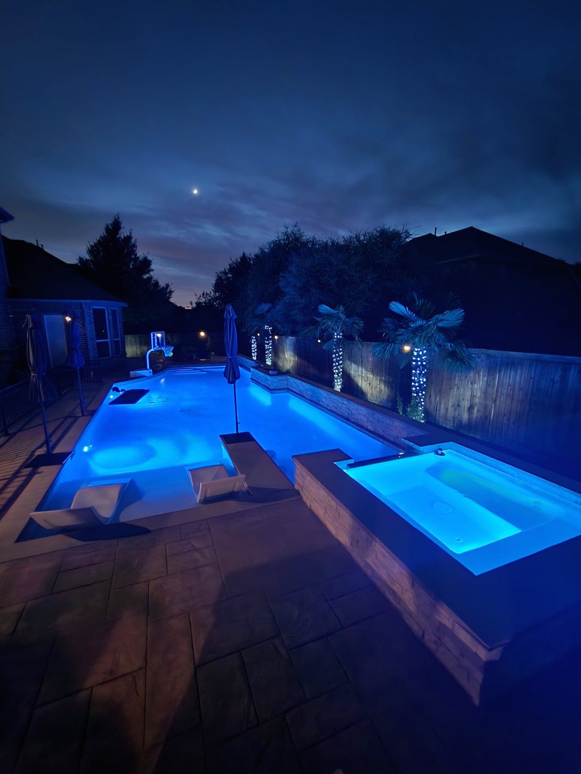 Luxury pool and spa with blue LED lighting